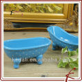 Bañera de cerámica de forma oval de color azul mini